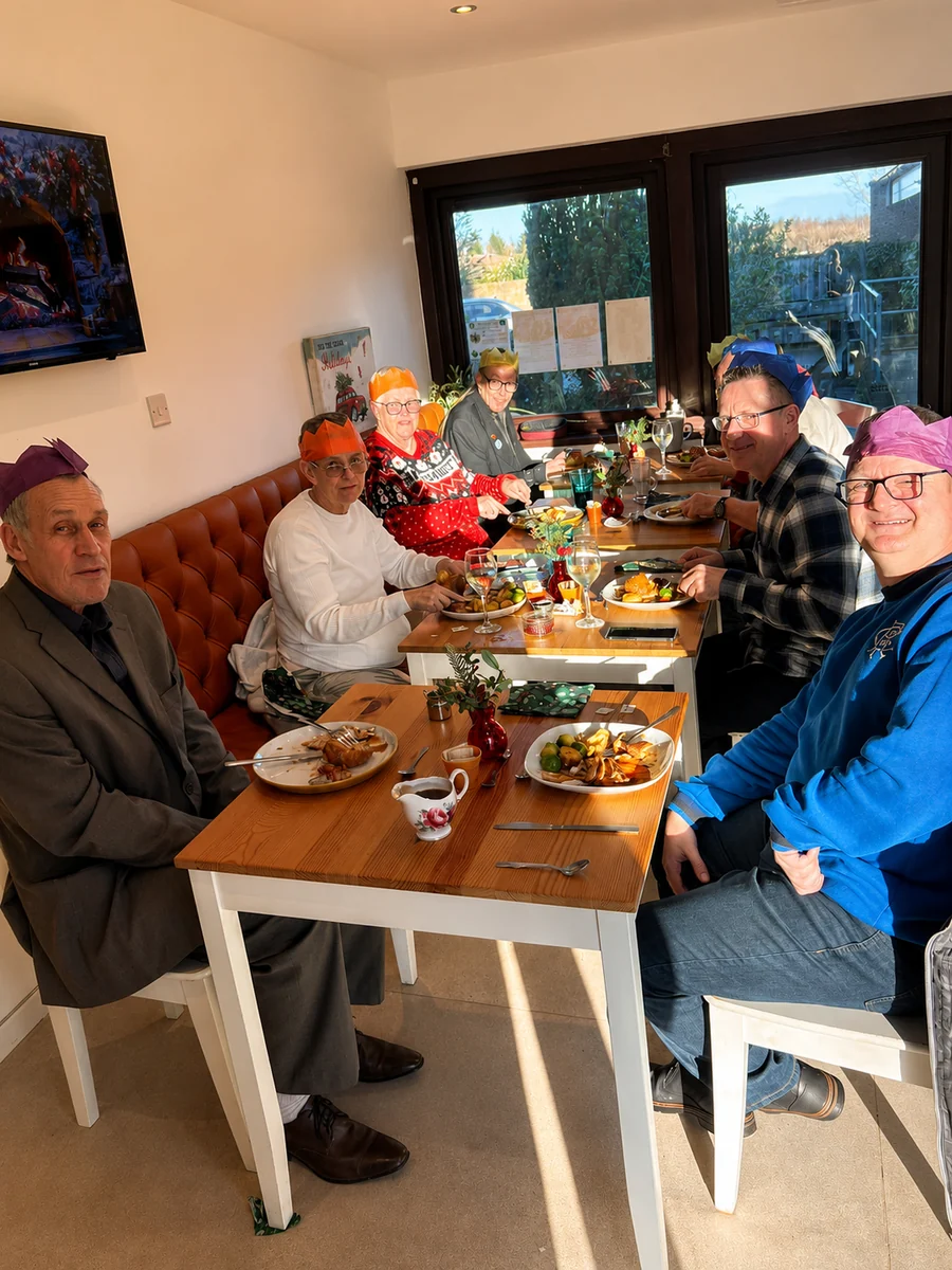 A group of guests sharing a festive meal inside Oakerside Tea Rooms