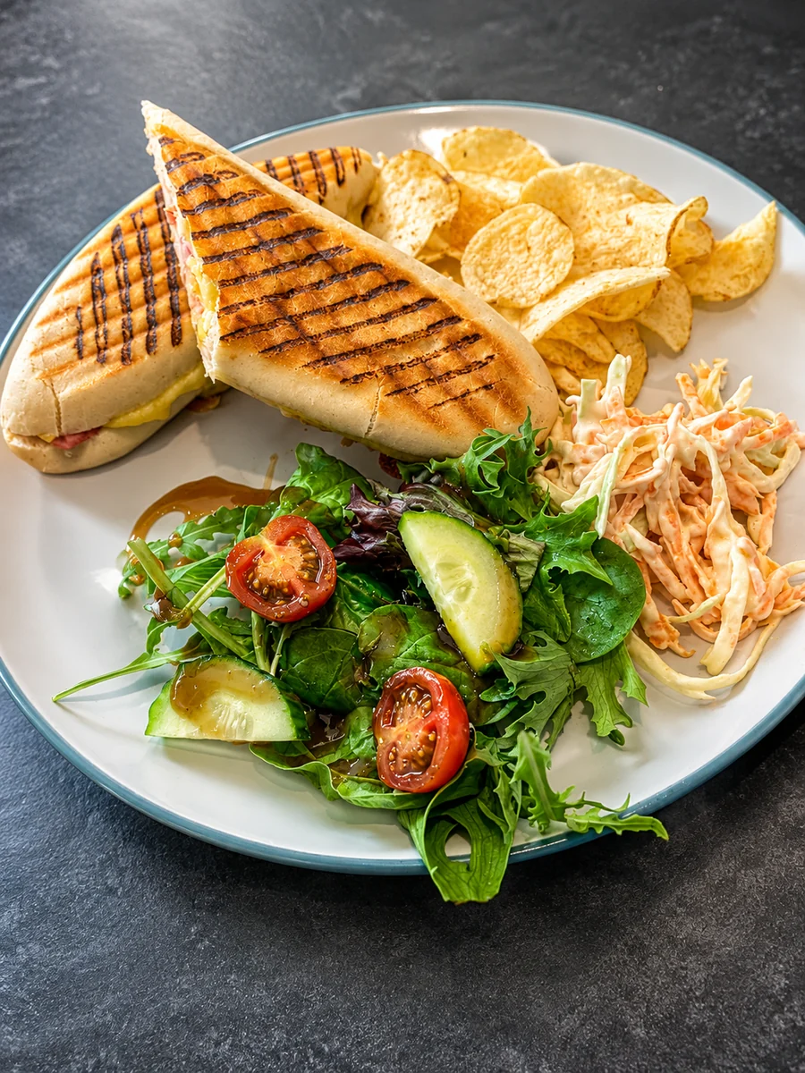 A toasted panini served with salad, crisps and coleslaw at Oakerside Tea Rooms